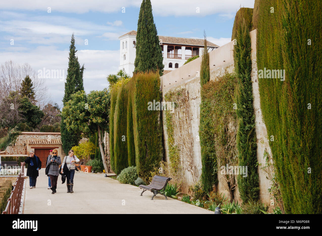 Granada, Andalusia, Spain : Tourists walk in the gardens of the Generalife palace inside the Alhambra and Generalife complex. Stock Photo