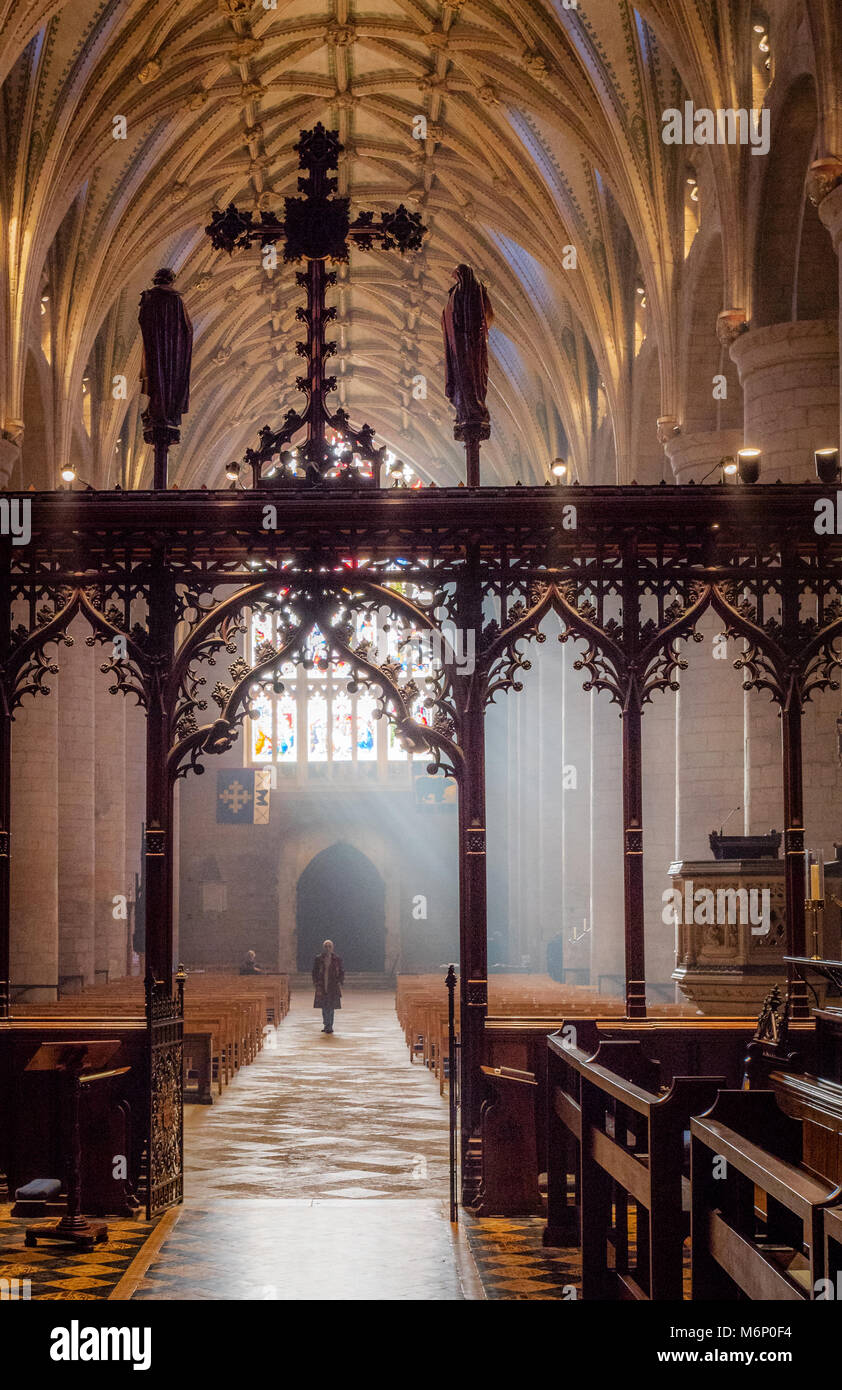 Interior of Tewkesbury Abbey in Worcestershire looking through the rood screen along the aisle to the Norman nave Stock Photo