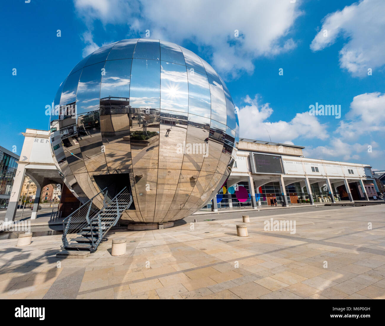 Millennium Square in Bristol UK with the Planetarium in the form of a huge walk-in mirror ball dominating the large public space Stock Photo