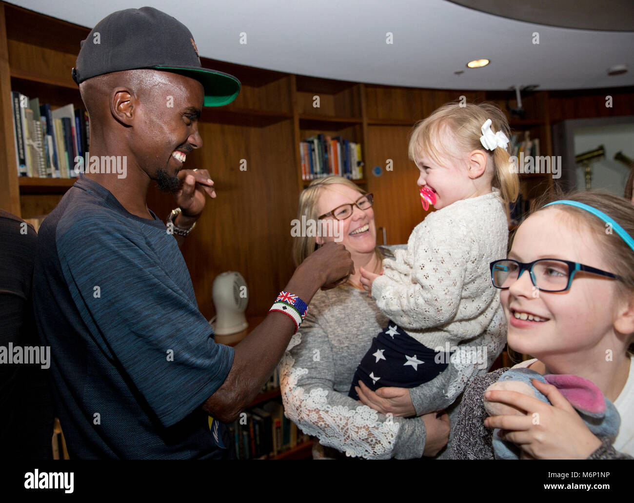 Sir Mo Farah surprises families from the North West who have been chosen to take part in the Simplyhealth Great Manchester Run Family Challenge. PRESS ASSOCIATION. Issue date: Monday March 5, 2018. The Parry family, from Prestwich in Greater Manchester and the Wilkinson family from Bolton travelled to South-East London where they met Great Britain’s most successful distance runner. Photo credit should read: Isabel Infantes/PA Wire Stock Photo