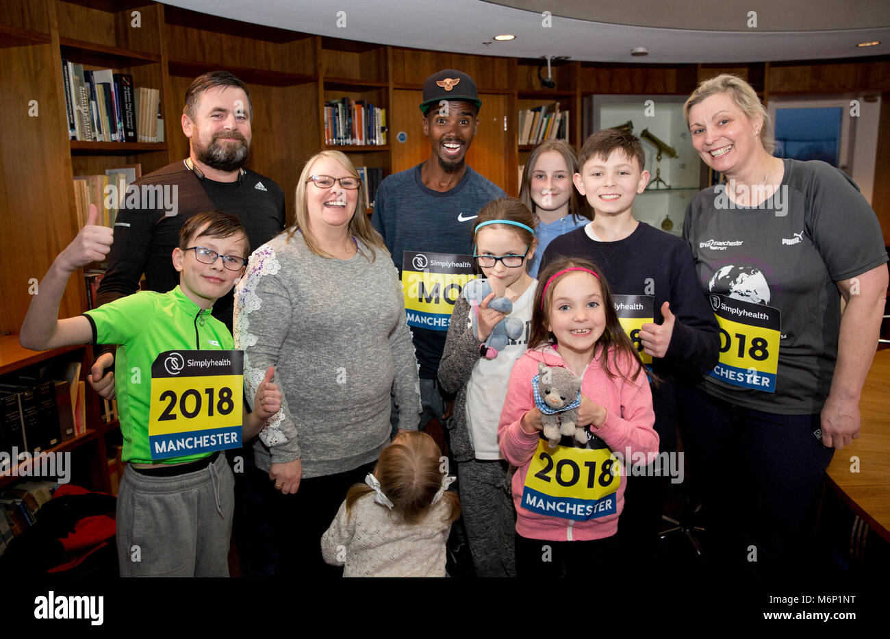 Sir Mo Farah surprises families from the North West who have been chosen to take part in the Simplyhealth Great Manchester Run Family Challenge. PRESS ASSOCIATION. Issue date: Monday March 5, 2018. The Parry family, from Prestwich in Greater Manchester and the Wilkinson family from Bolton travelled to South-East London where they met Great Britain’s most successful distance runner. Photo credit should read: Isabel Infantes/PA Wire Stock Photo