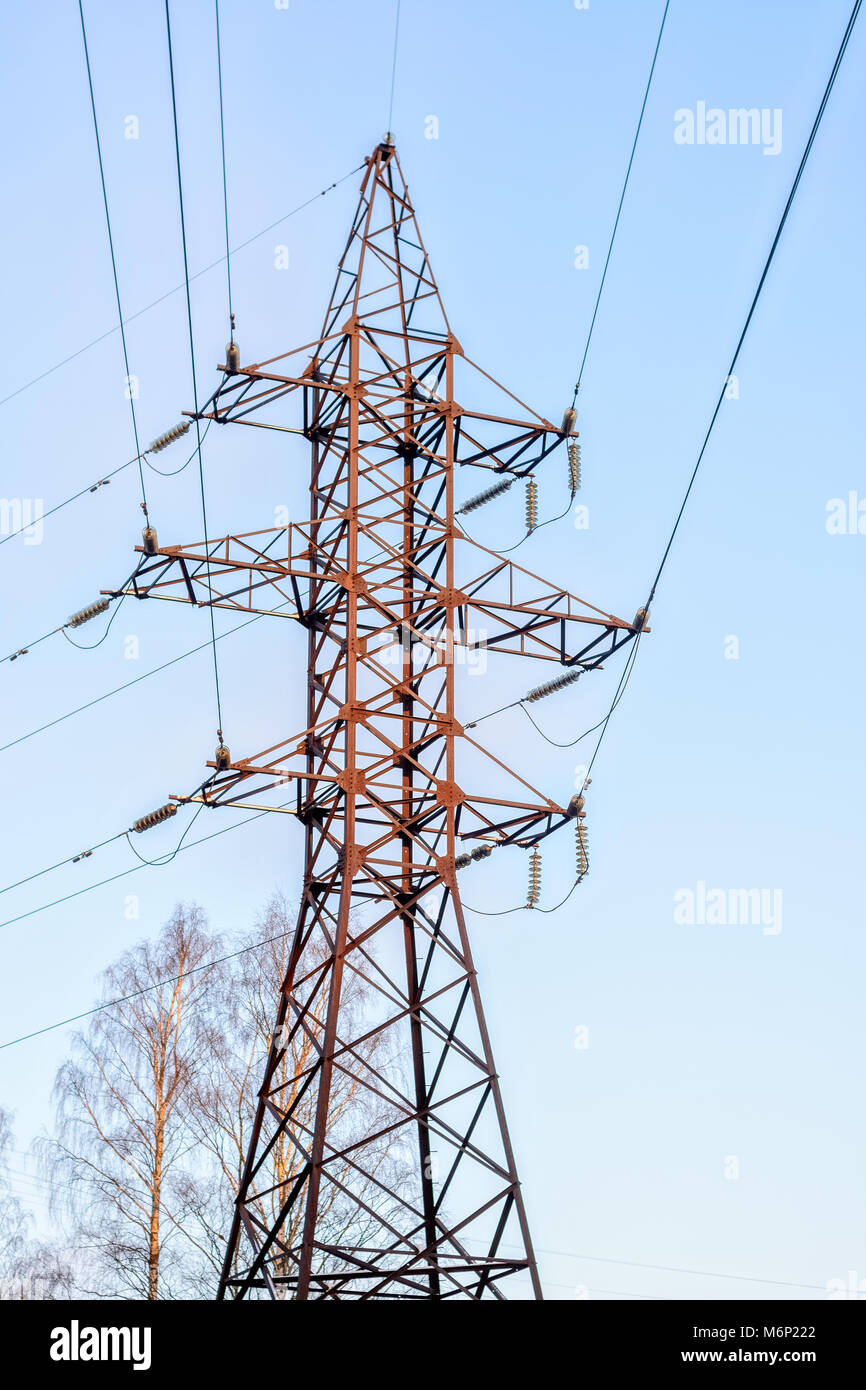 Steel support of the line of highvoltage wires against the blue sky