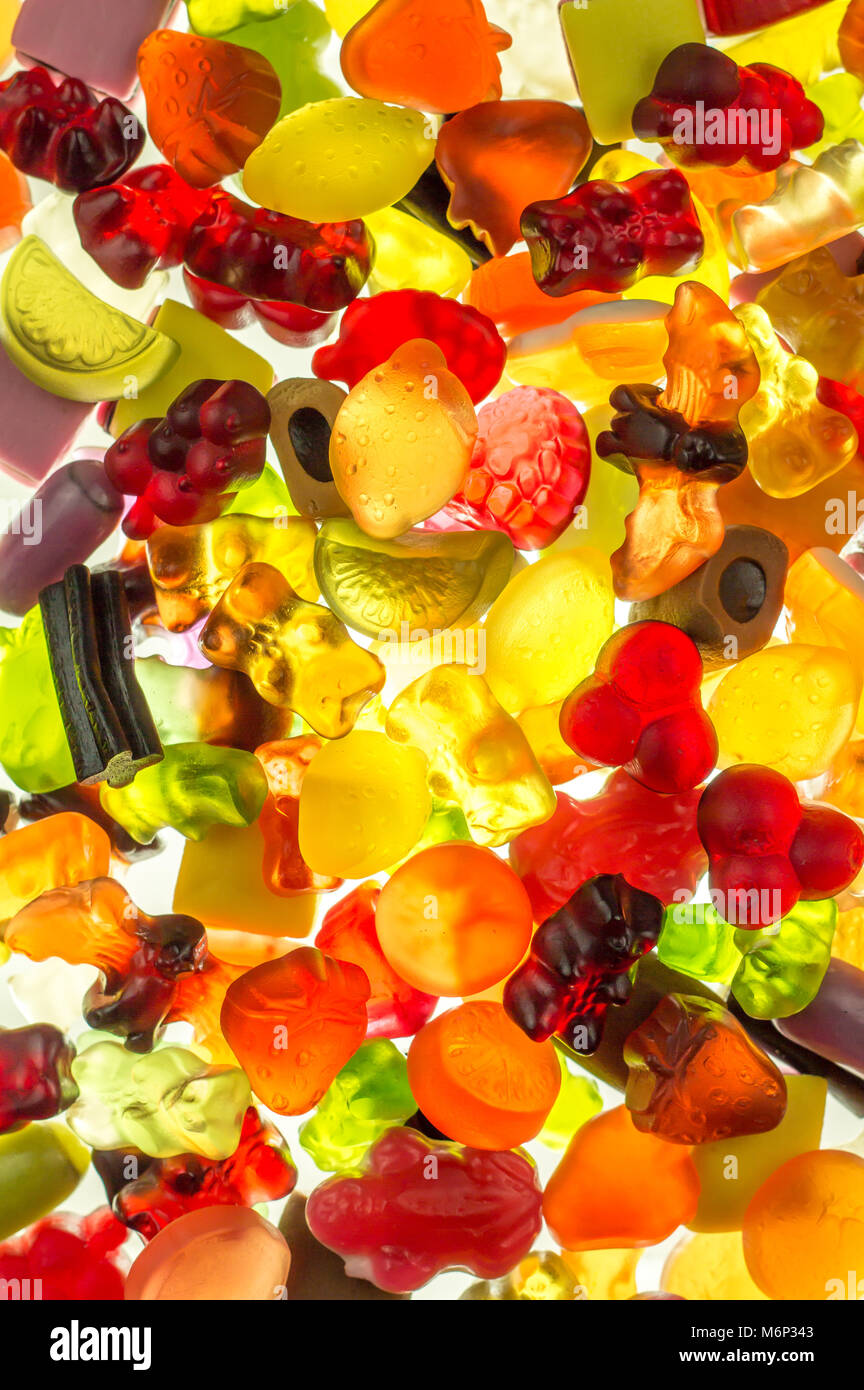 colorful fruit gums mix bright translucent on illuminate underground Haribo sweets Stock Photo