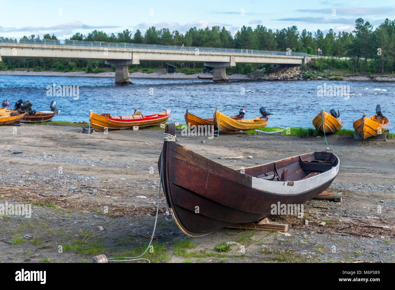 Wooden boats on the river bank, Finnmark, Norway Stock Photo - Alamy