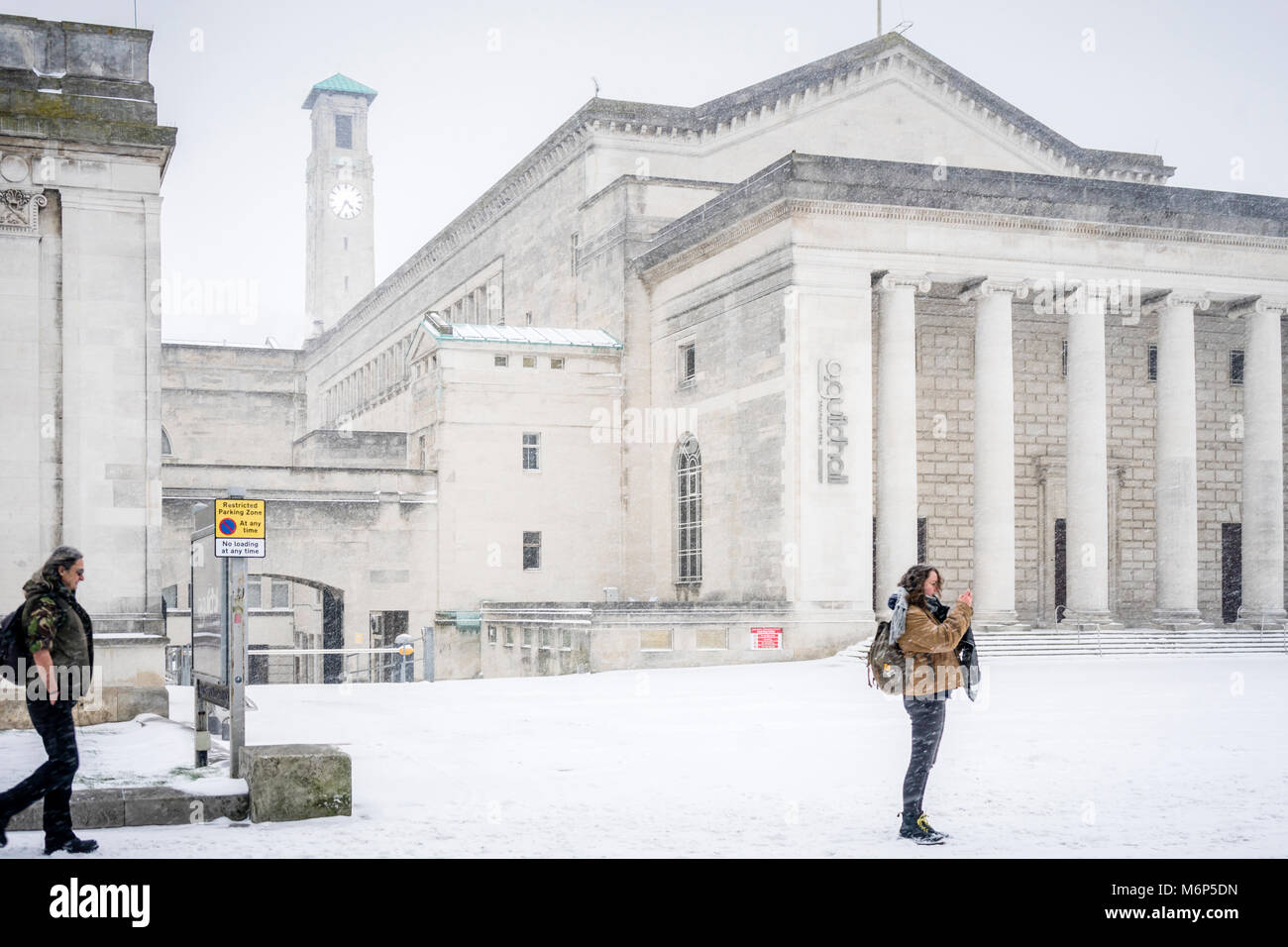 The O2 Guildhall and the Civic Centre Clock Tower in Guildhall Square during winter and heavy snowfall in Southampton, March 2018, England, UK Stock Photo