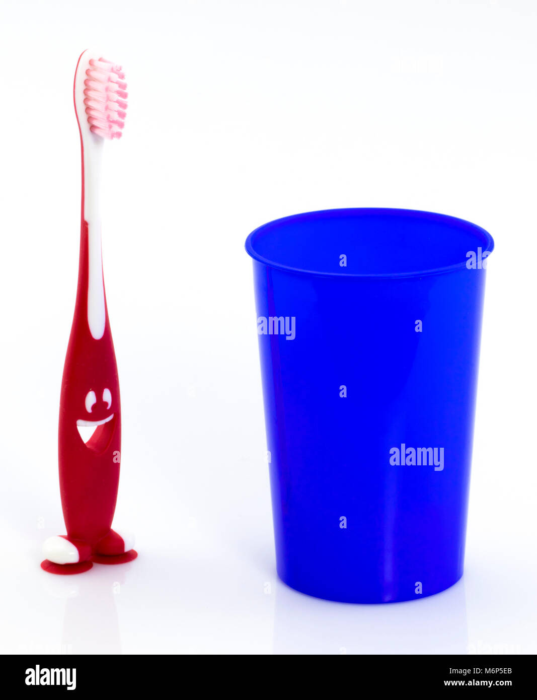 Toothbrushes in glass isolated on white background Stock Photo - Alamy