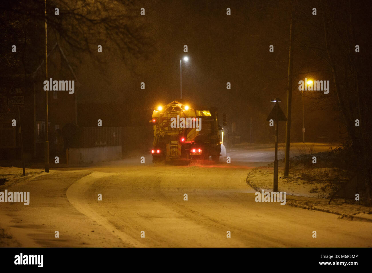 A gritting lorry treating snowy roads in Redditch, Worcestershire, UK Stock Photo