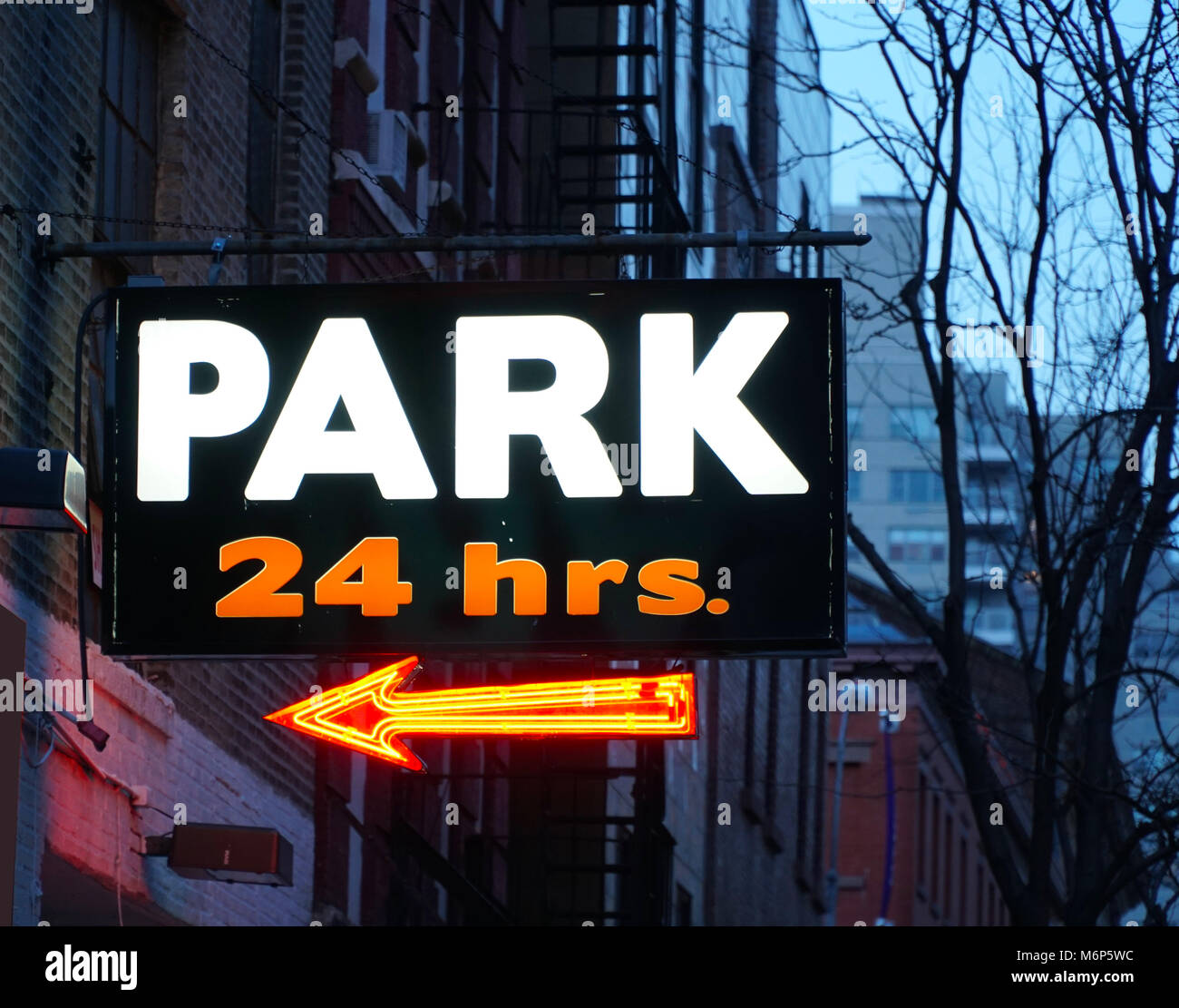 24 Hour Parking Garage Sign In Neon Colors In Manhattan Village New York City Expensive Rates To Park Cars And Vehicles Any Time Of Day Stock Photo - Alamy