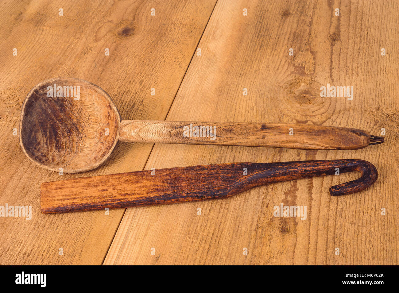 Old kitchen utensils on a wooden table Stock Photo