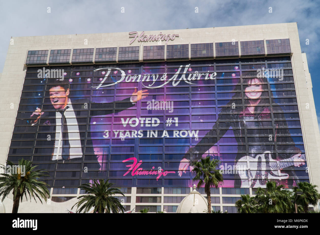 Las Vegas Nevada - Circa 2017: Flamingo hotel and casino exterior daytime facade. Tower billboard for Donny and Marie Osmond painted over room windows Stock Photo