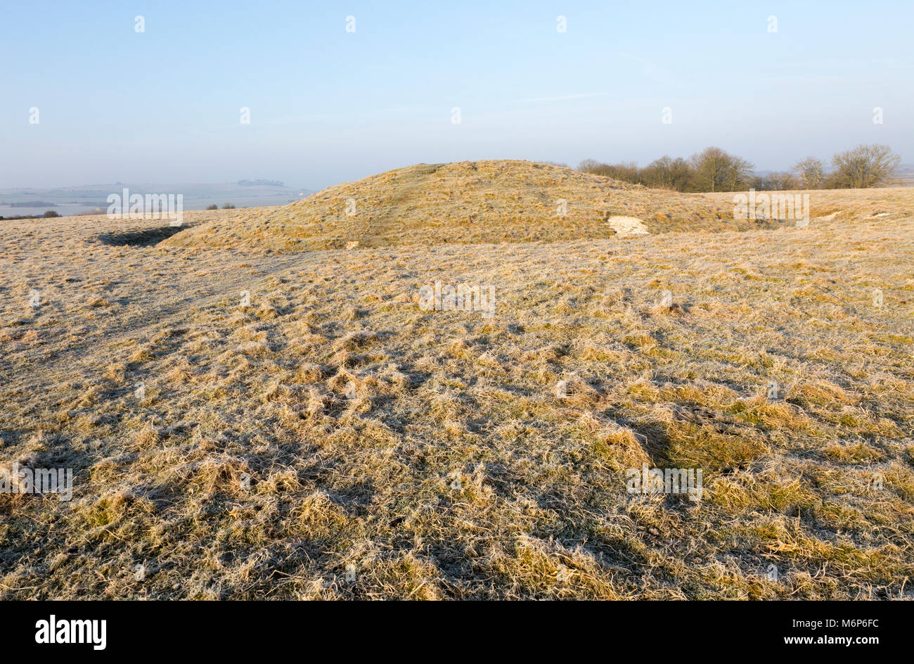 Bronze Age bowl barrow on Windmill Hill, a Neolithic causewayed enclosure, near Avebury, Wiltshire, England, UK Stock Photo
