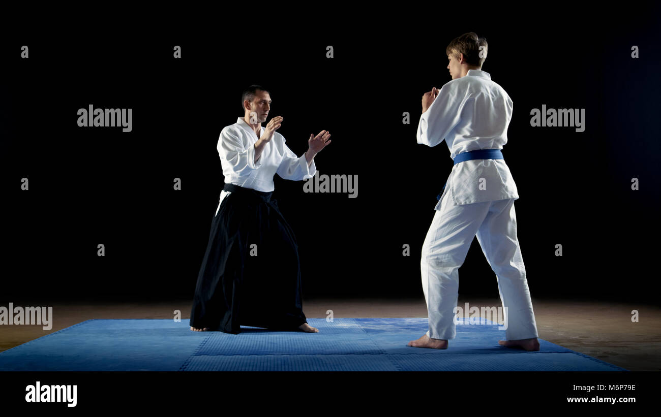 Martial Arts Master Wearing Traditional Samurai Hakamas Teaches Young