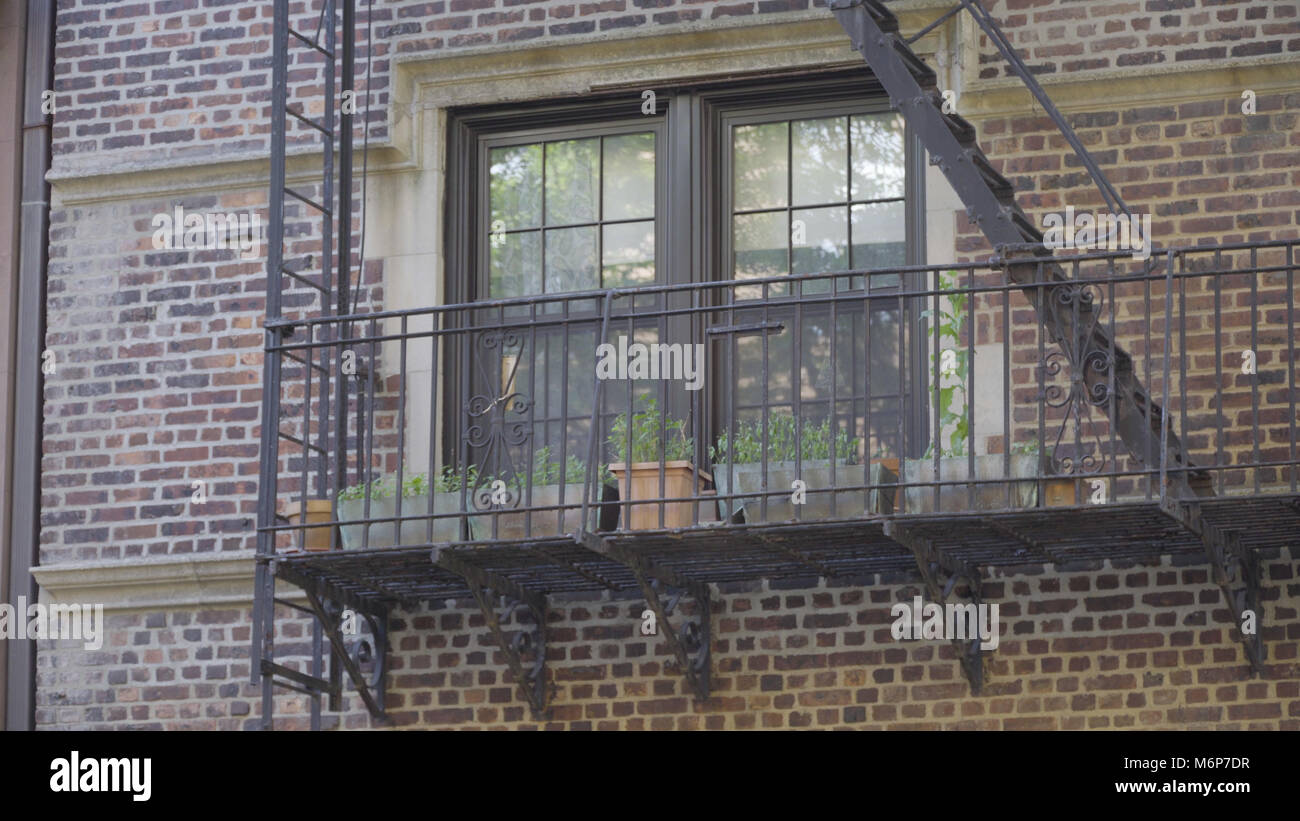Exterior establishing photo of a generic brick apartment building ...