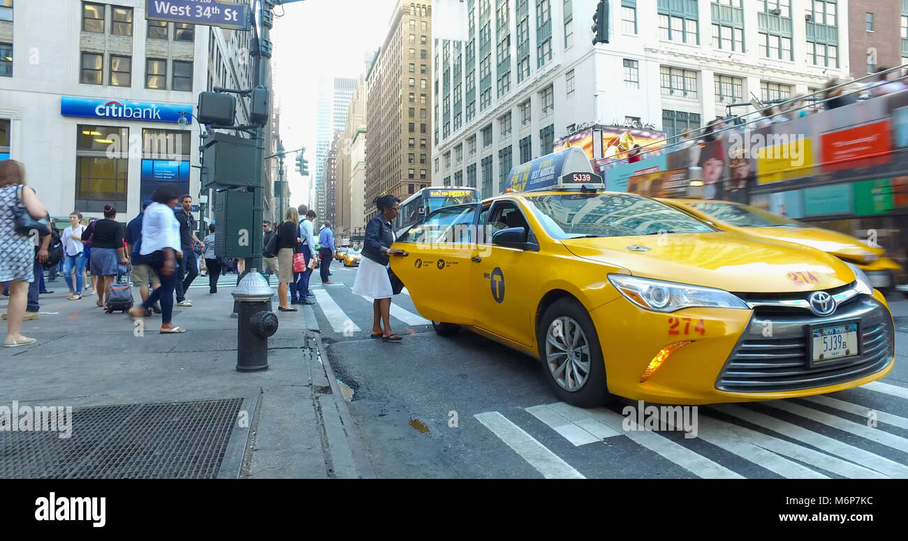 New York City Circa 2017 Woman Hail Enter Back Door Of Yellow