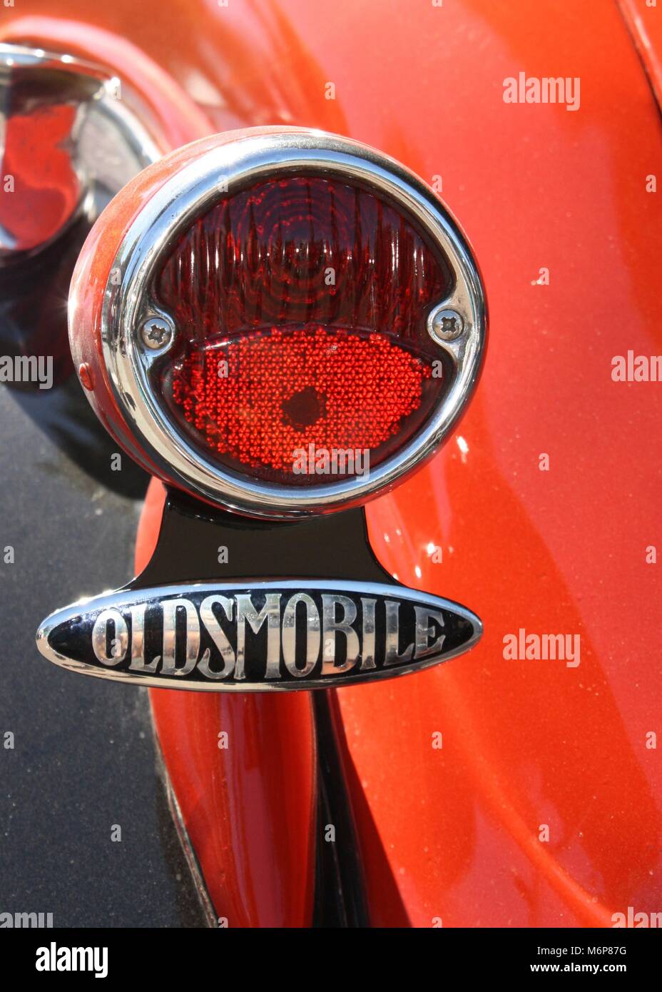 Vintage Oldsmobile tail light and logo Stock Photo