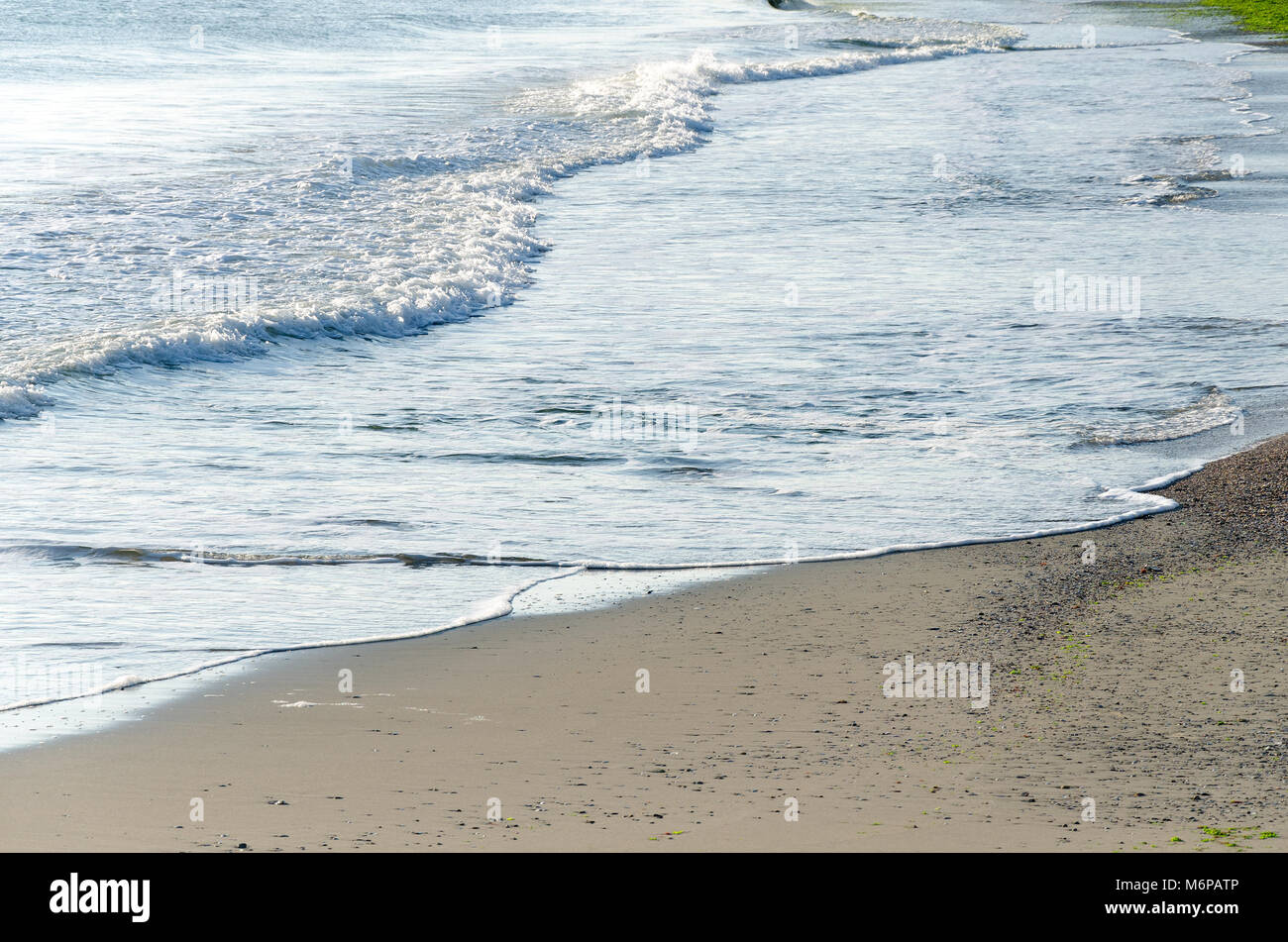 Seascape background of gentle sea waves lapping along the coastline of Black Sea, Bulgaria Stock Photo
