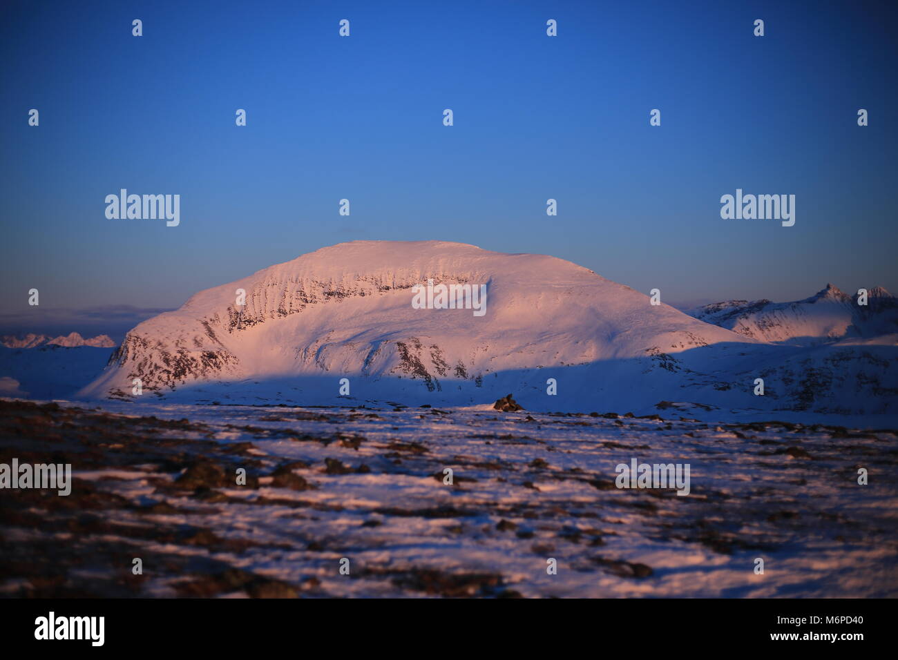Mt. Tromsdalstind In Winter Sunset Stock Photo