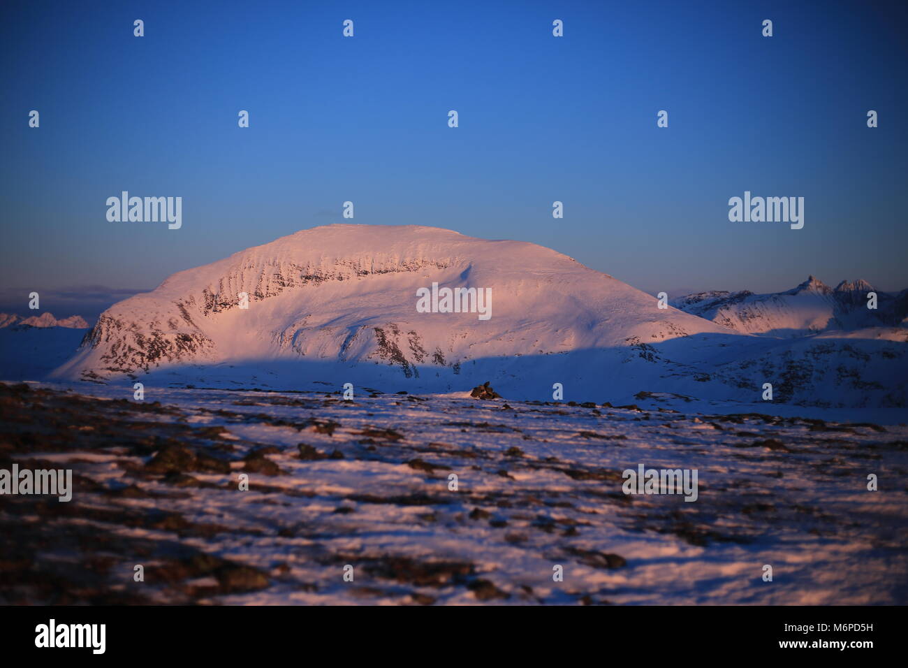 Mt. Tromsdalstind In Winter Sunset Stock Photo