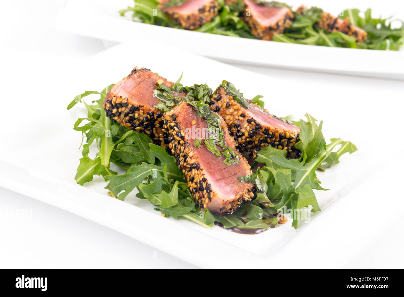 tuna tataki sesame crust appetizer plate over wood backgroung Stock