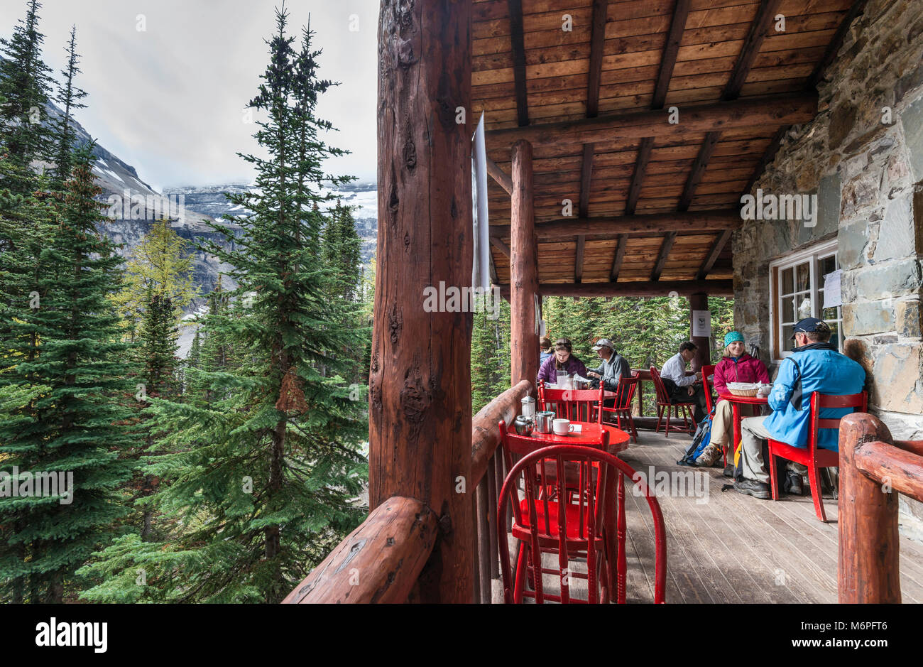 Hikers at Plain of Six Glaciers Tea House terrace, near Mount Victoria