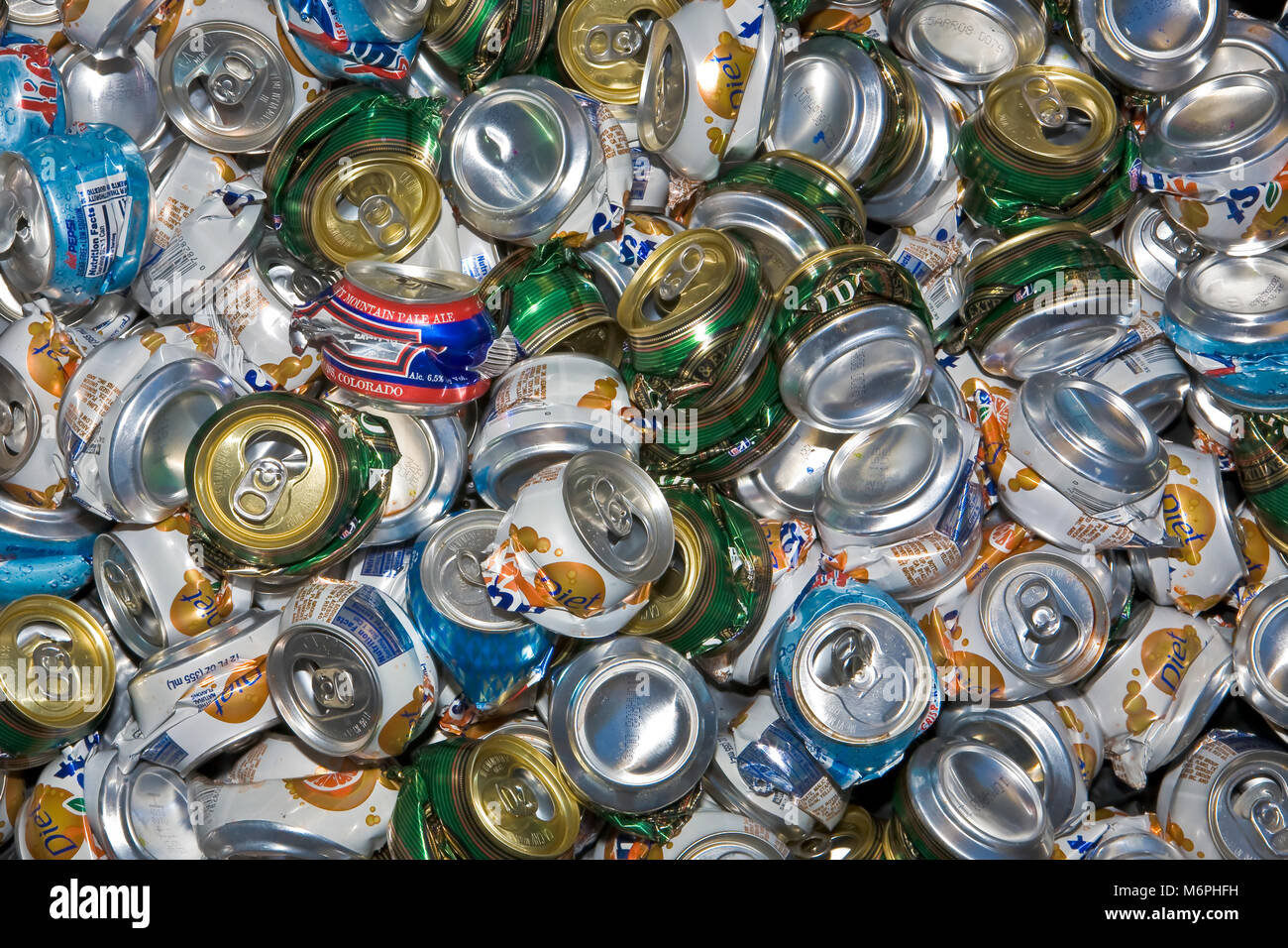 Individually crushed aluminum cans for recycling. Crushed cans take up the space for
