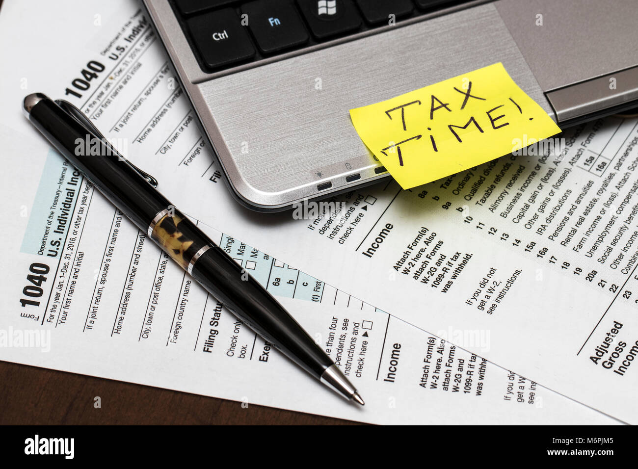 1040 tax form laptop hi-res stock photography and images - Alamy