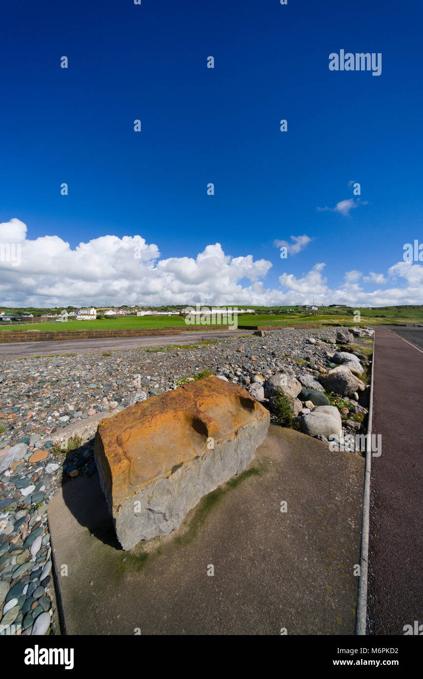 The former industrial foreshore of Harrington in Cumbria, on the Solway Firth, where a magnesite processing works once stood behind a sea wall. Concre Stock Photo