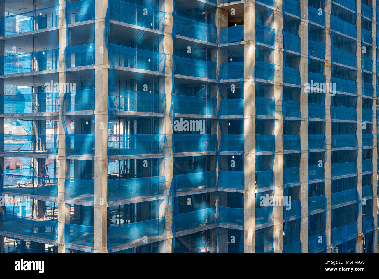 Detail of high rise condominium building during construction. Stock Photo