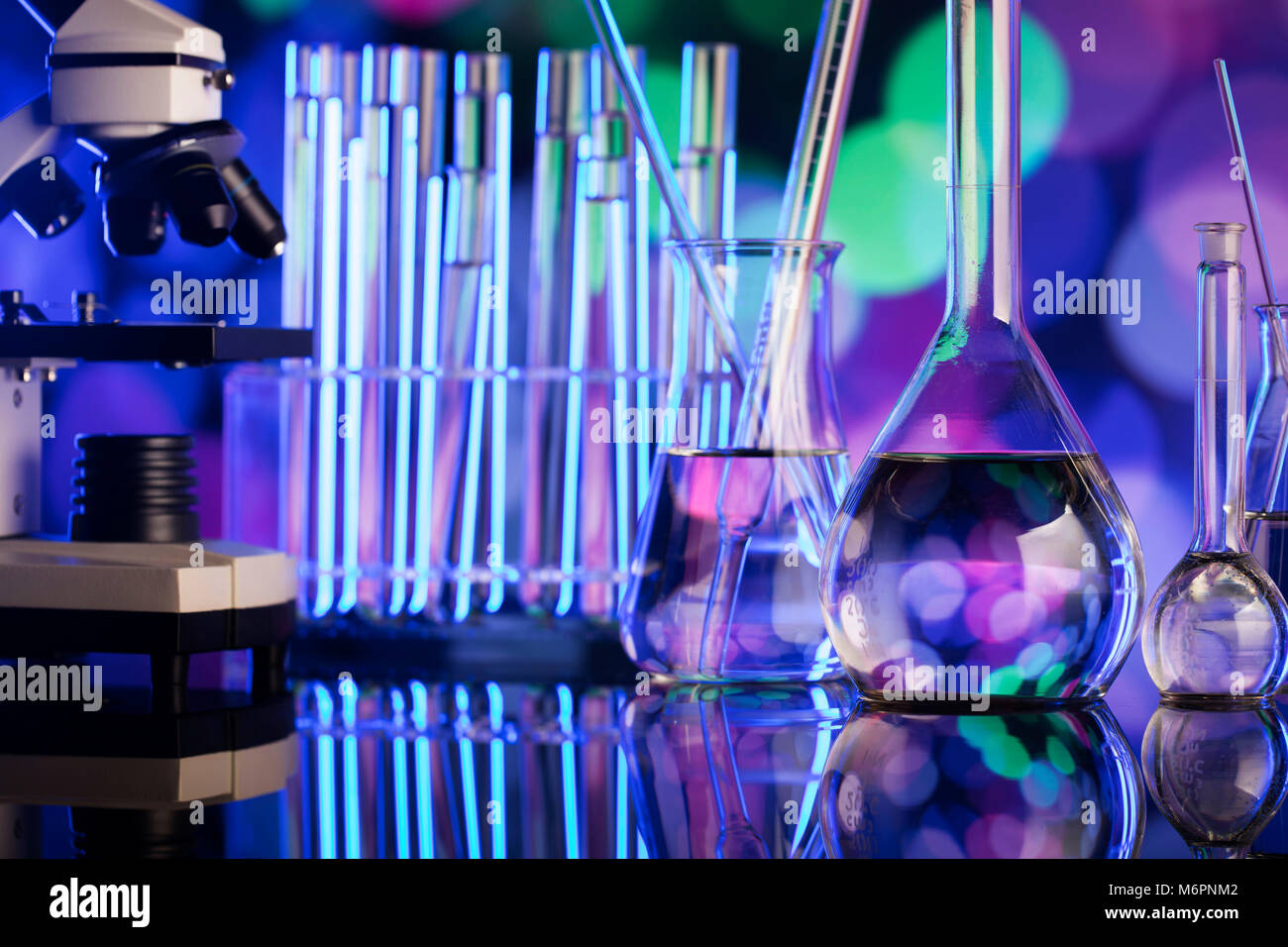 Science concept background. Microscope and laboratory glassware
