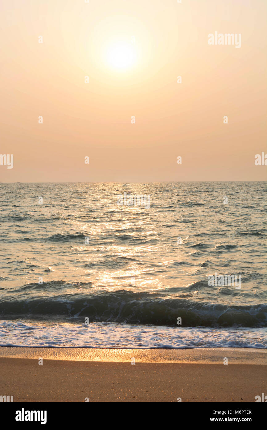 sunset over Beach and tropical sea- India Stock Photo - Alamy