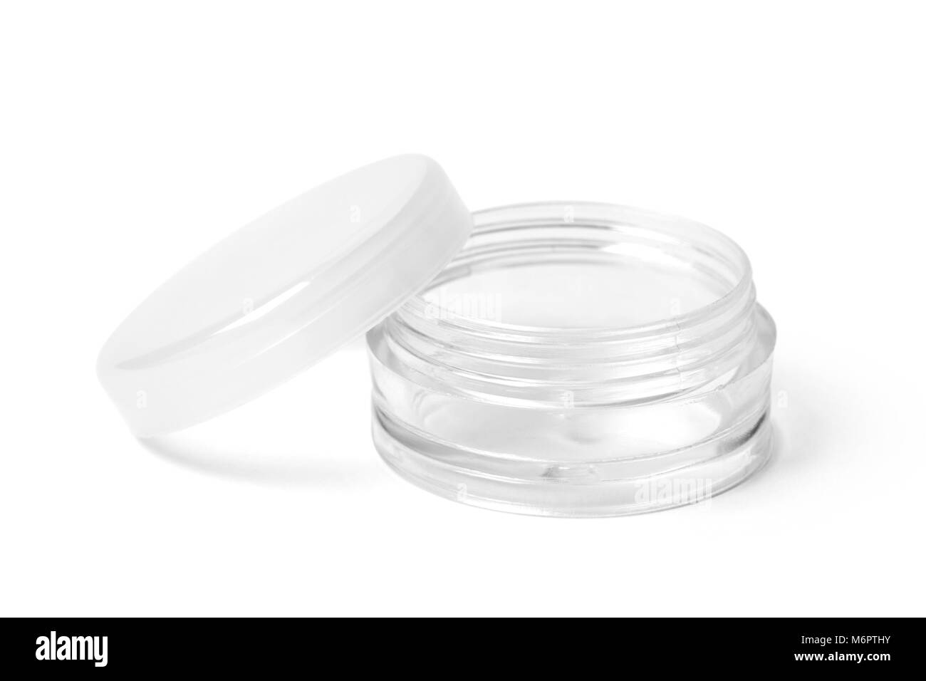 Open empty colorless transparent plastic container for cosmetic products. Image with working path. Stock Photo
