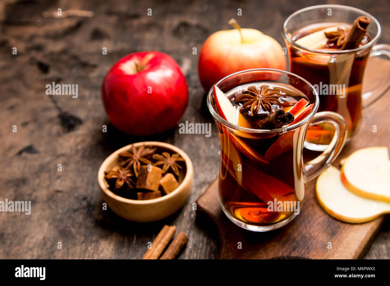 hot spicy beverage. Hot drink (apple tea, punch) with cinnamon stick