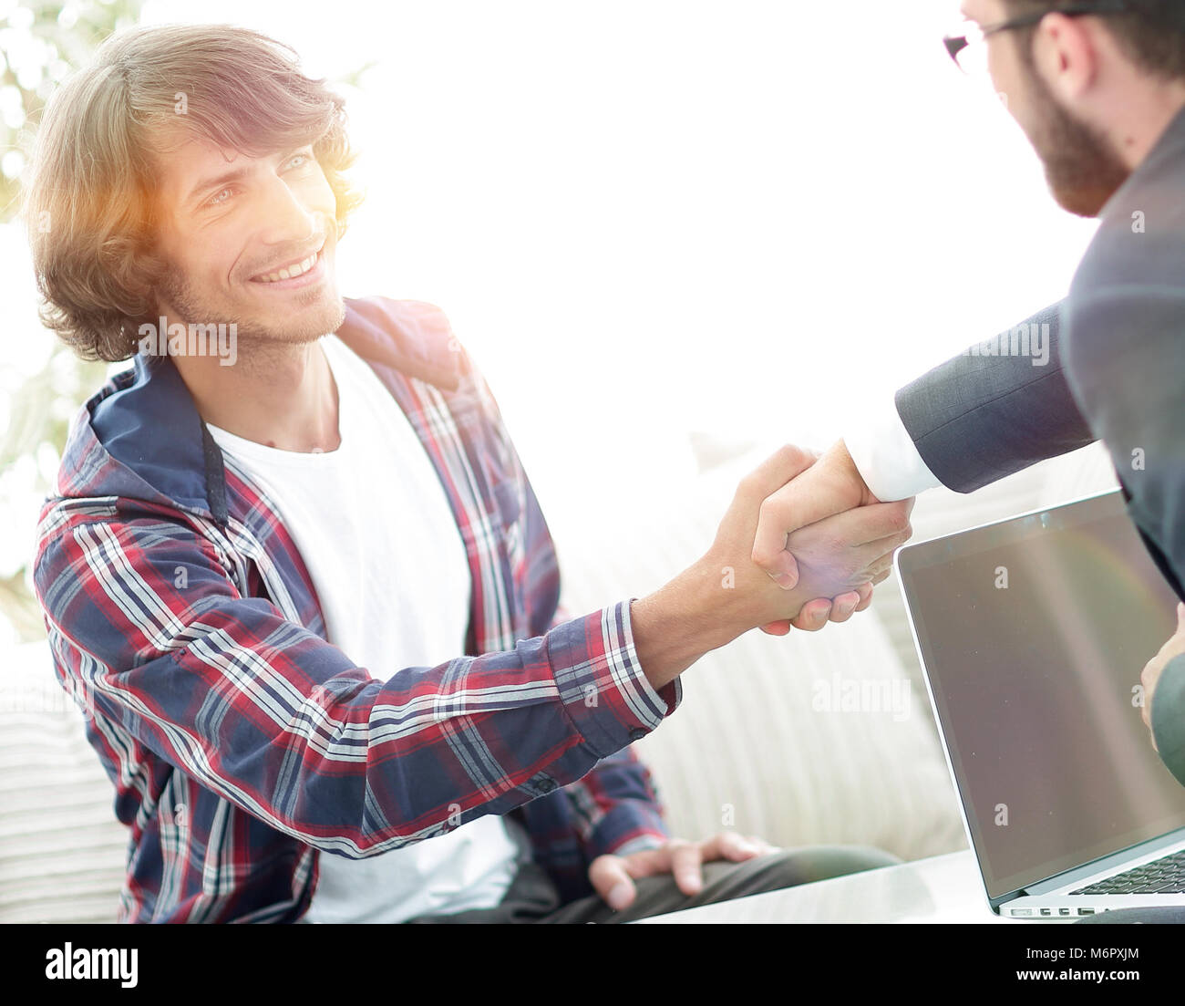 manager shakes hands with his client Stock Photo - Alamy