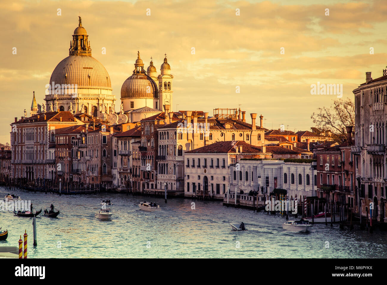 Gorgeous view of the Grand Canal and Basilica Santa Maria della Salute during sunset, Venice, Italy Stock Photo