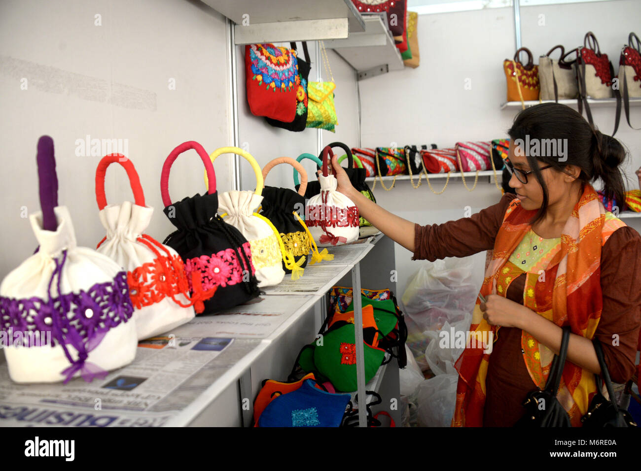 Dhaka, Bangladesh. 6th Mar, 2018. A visitor looks at jute products at a stall of jute fair in Dhaka, Bangladesh, on March 6, 2018. The three-day fair kicked off on Tuesday. Credit: Salim Reza/Xinhua/Alamy Live News Stock Photo