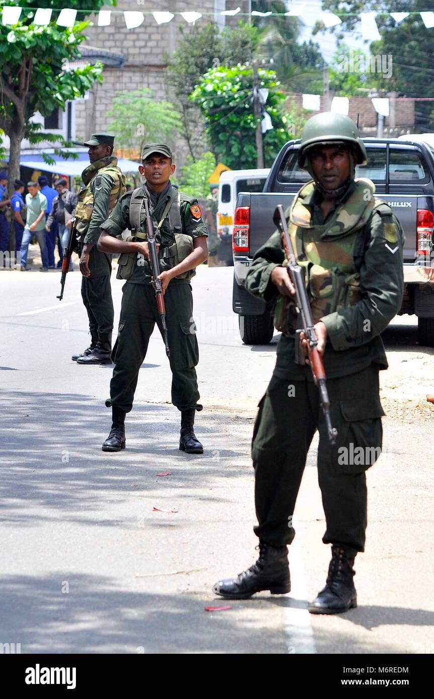 Kandy, Sri Lanka. 6th Mar, 2018. Sri Lankan security personnel stand