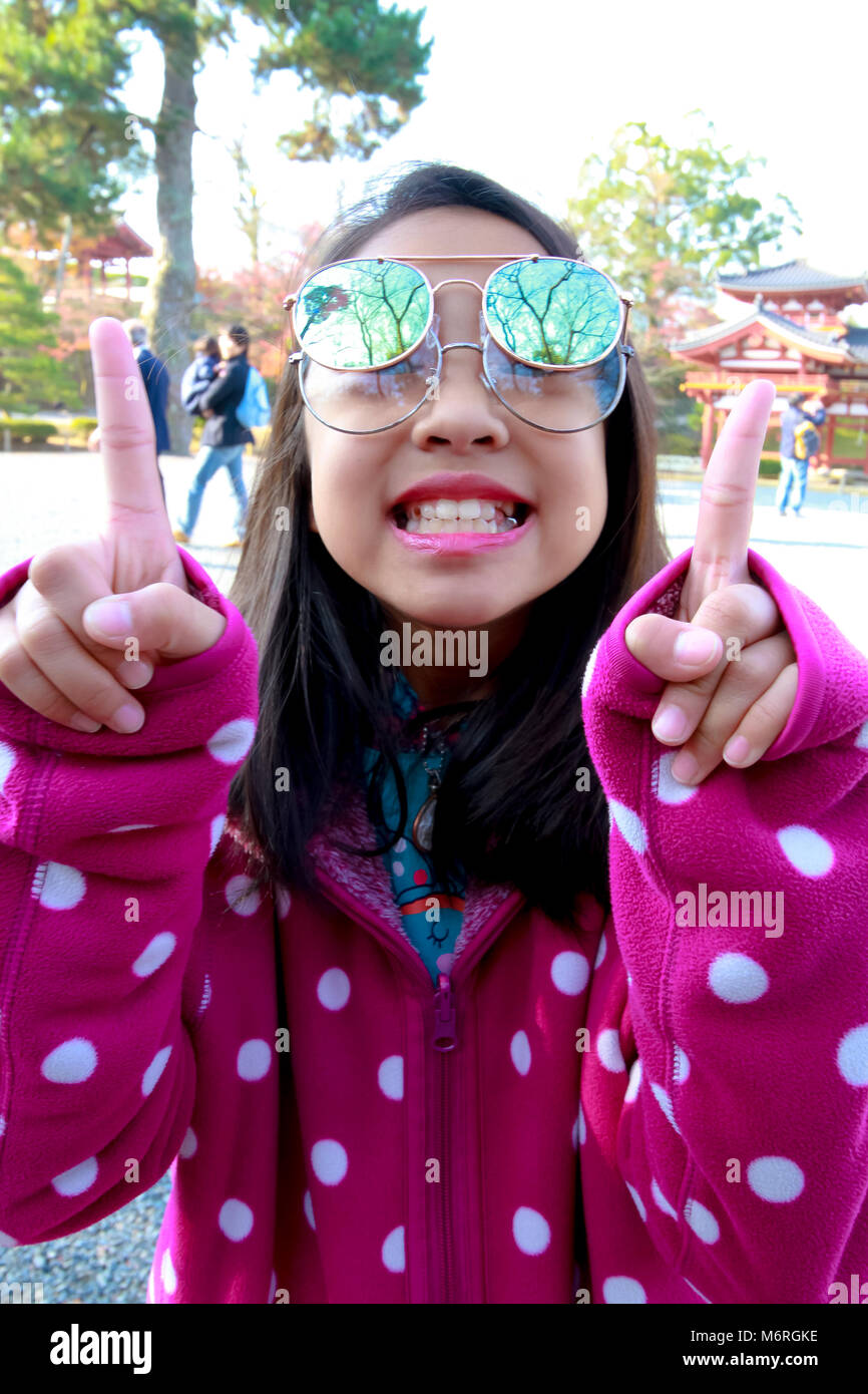 Portrait of young beautiful girl with maple leaf Stock Photo - Alamy