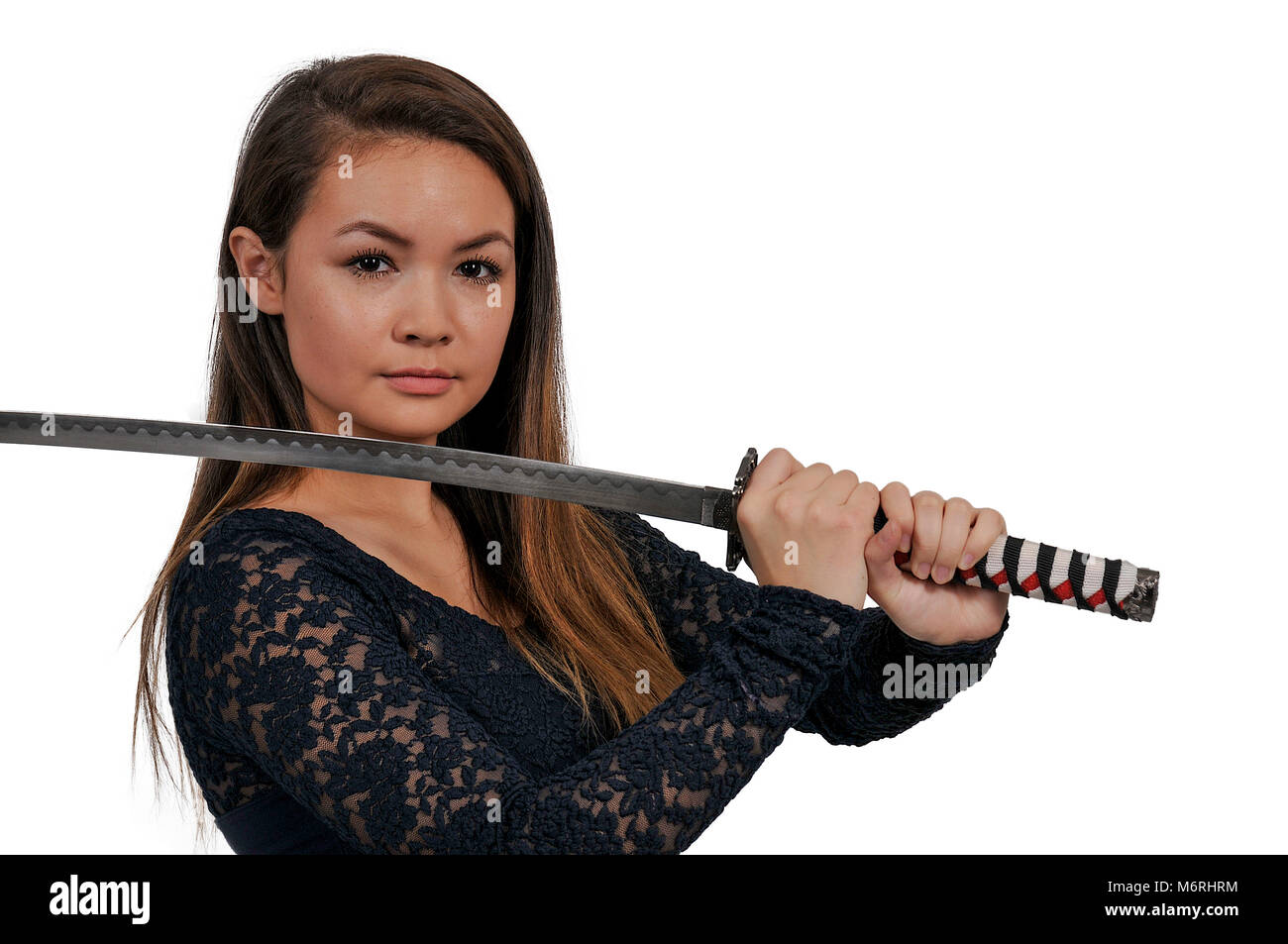 Young woman with a samurai bushido katana sword Stock Photo Alamy