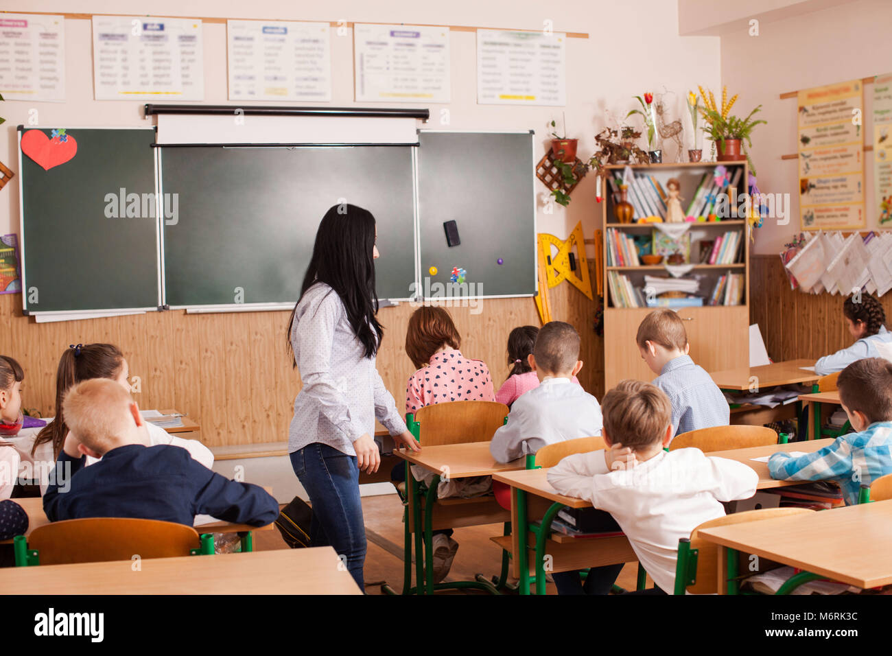 Teacher starts the lesson Stock Photo - Alamy