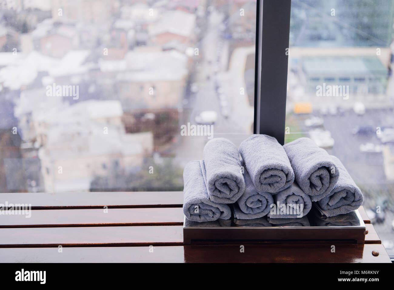 Rolled white fitness gym towel for workout, sports and exercise on a ...