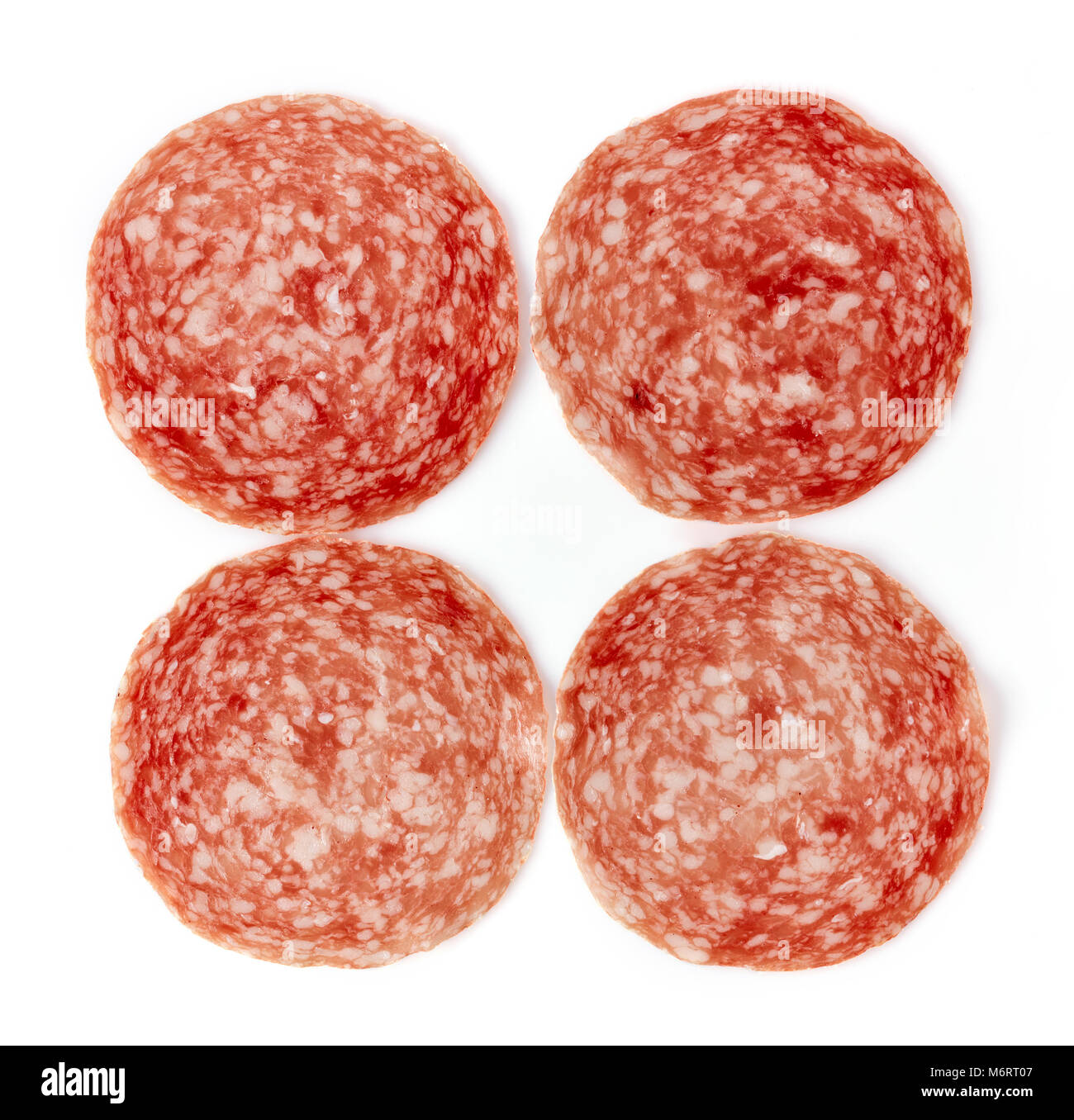 Sliced summer sausage isolated on white background, top view Stock