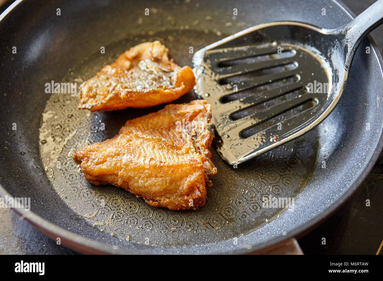 Cooking, Frying nile tilapia fish on the pan with oil Stock Photo Alamy
