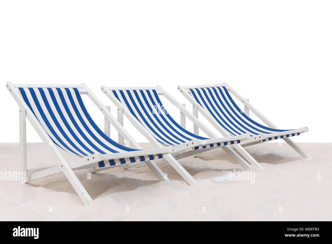 Three blue and white striped beach chair on the sand beach isolated on