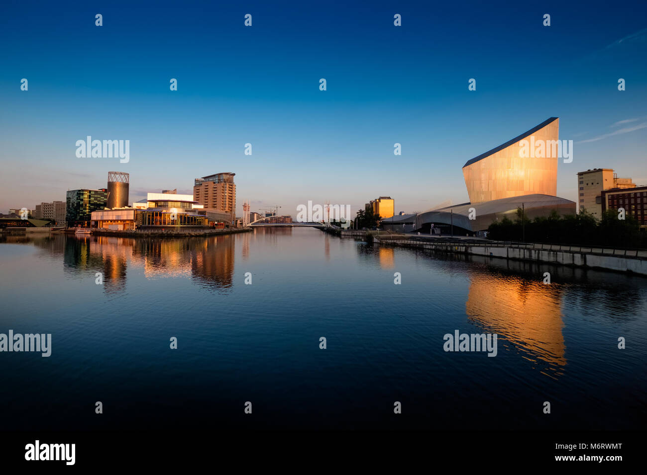 Lowry Centre at Salford Quays and Imperial War Museum on the Manchester ship canal Stock Photo
