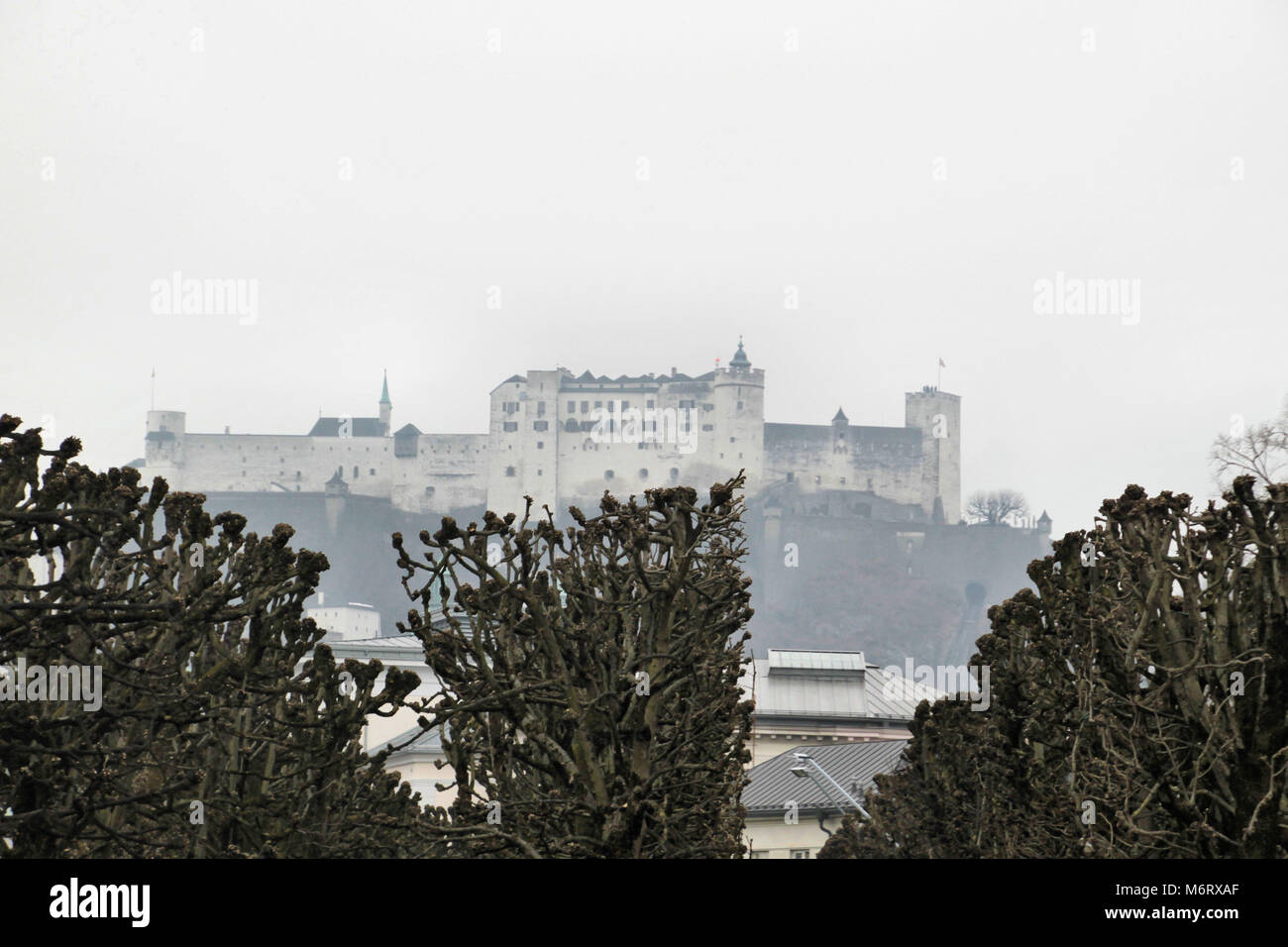 A view of Salzburg Castle in the mist Stock Photo