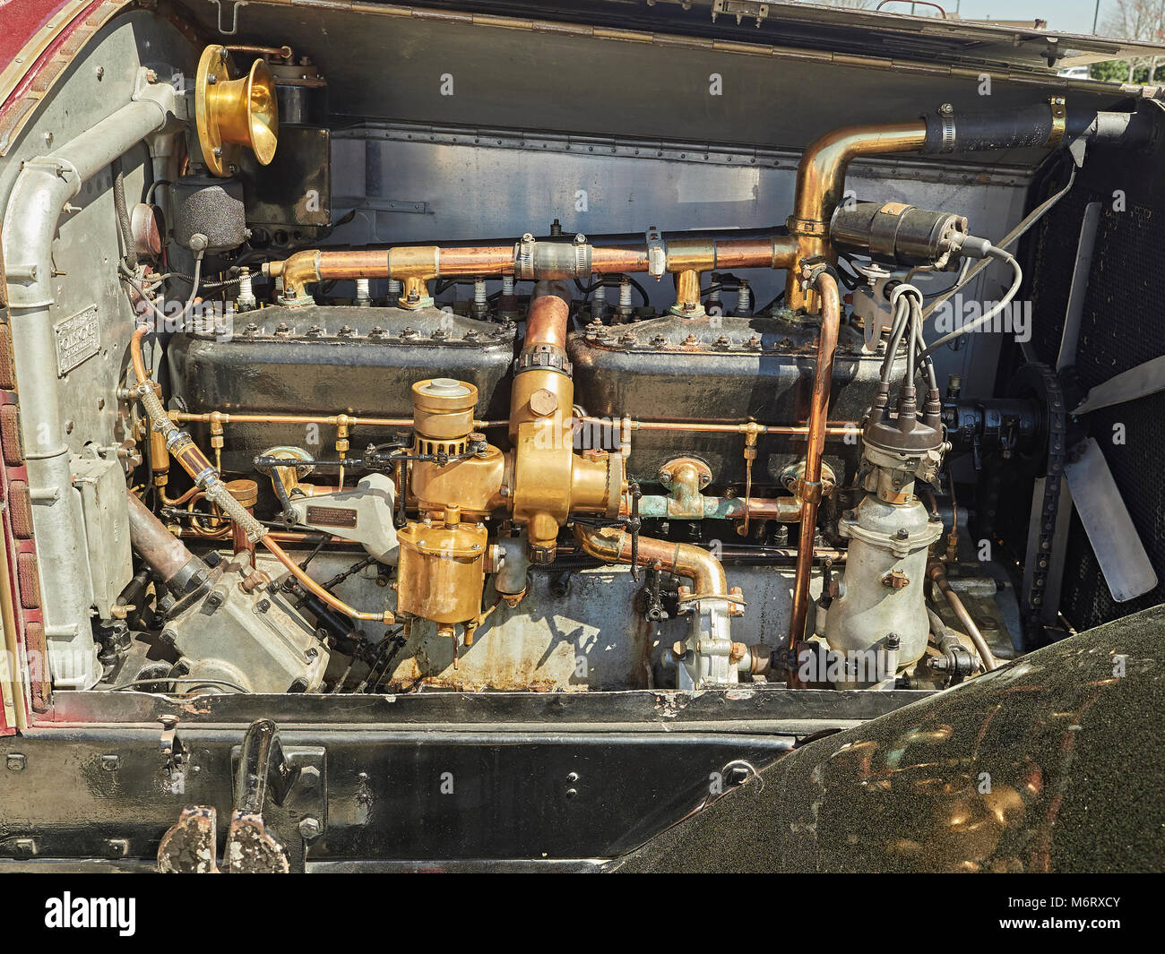 Engine compartment or motor bay of an antique 1924 Rolls Royce Silver Ghost showing the six cylinder motor of the classic vintage British motorcar. Stock Photo