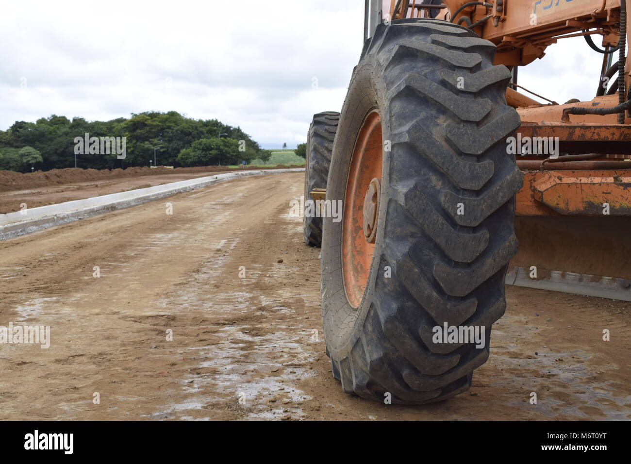 Tractor digging the ground Stock Photo Alamy