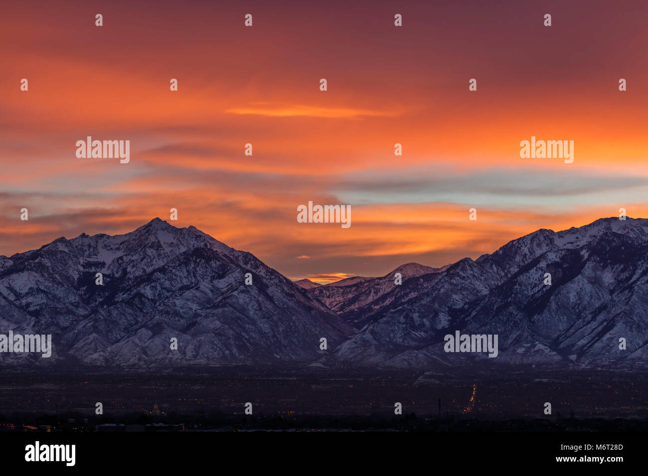Vibrant sunrise over the Wasatch Mountains in winter, Salt Lake County, Utah Stock Photo