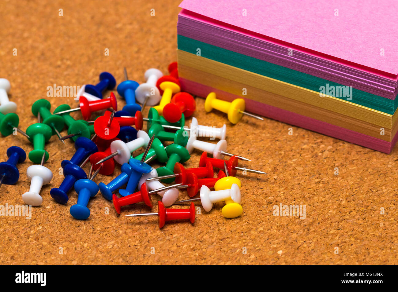 Group of colorful push pins on cork bulletin board Stock Photo Alamy