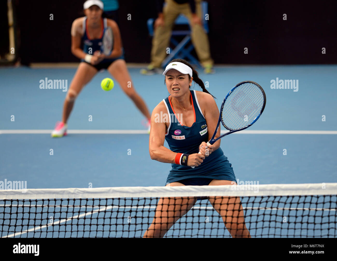 Latisha Chan Yun Jen (front) and Chan Hao Ching of Taiwan play in the women's doubles at the China Open tennis tournament in Beijing, October 2016 Stock Photo